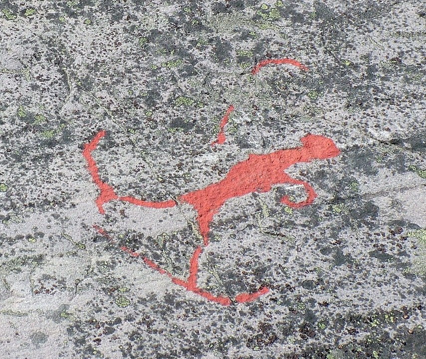 1000 BCE rock painting of hunter on skis in act of shooting bow