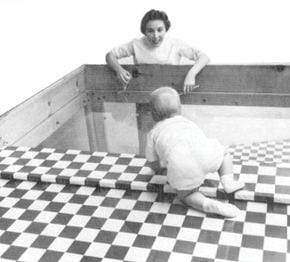 visual cliff experiment showing baby on table crawling toward mother