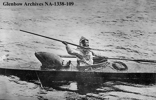 Inuit harpoon hunter in kayak