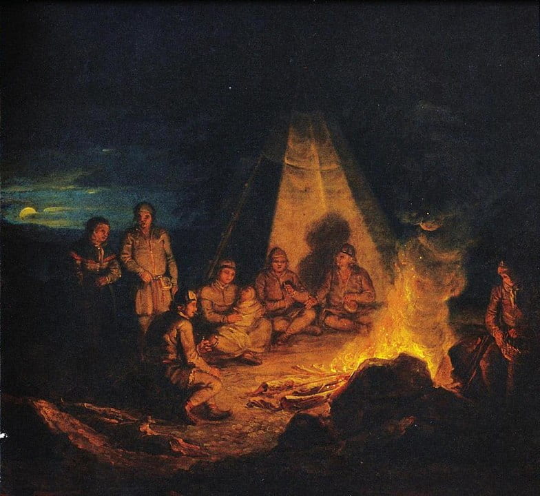 Saami people sitting around fire in front of tent