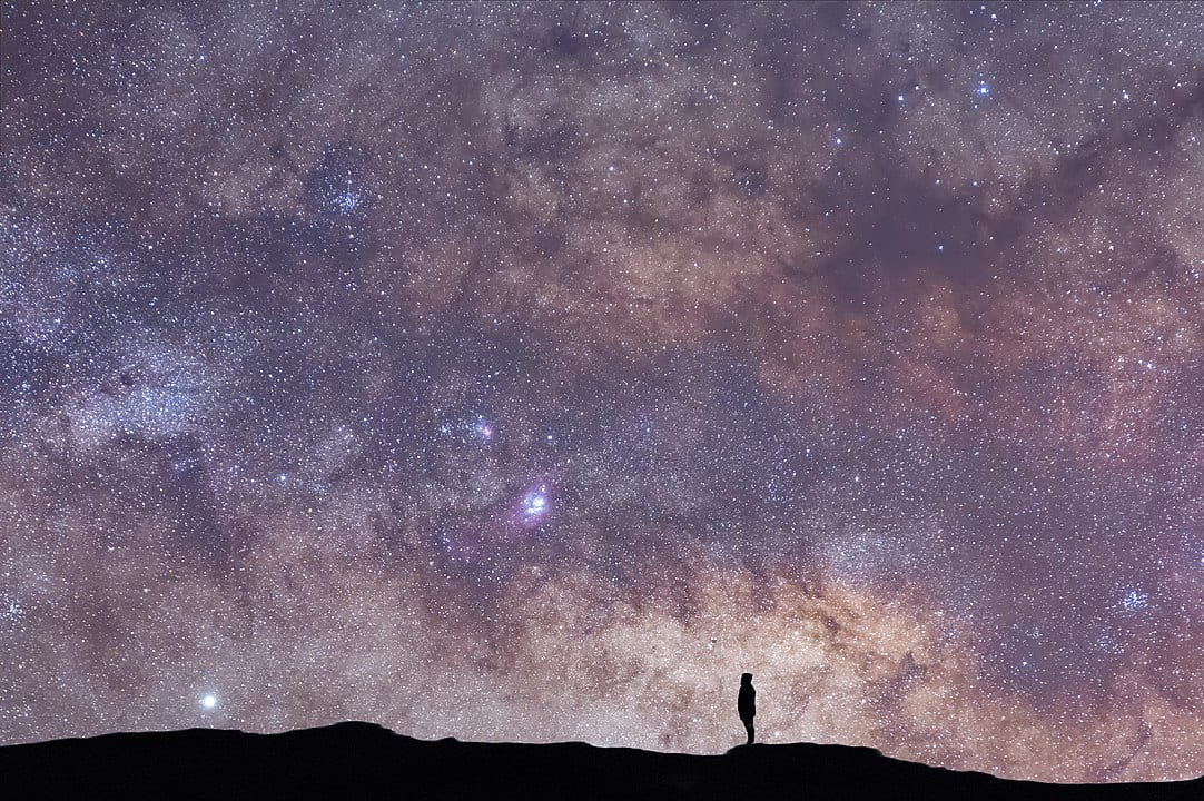 person gazing at stars